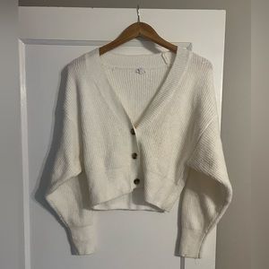 White crop top, v-neck sweater with buttons